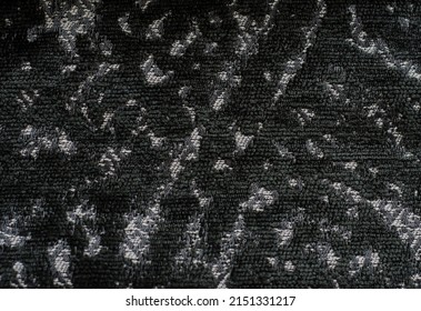 donkergrijze achtergrond met abstract patroon. textuur van lusstof.