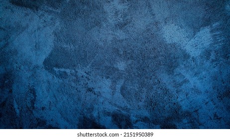 Fondo oscuro azul marino, hermoso resumen de papel tapiz decorativo de estuco. El arte de las superficies rugosas tiene espacios vacíos.