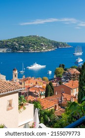 The famous Wellcome Hotel on the Cote d'Azur. Promenade Villefranche-sur-Mer, a resort on the French Riviera. Sea, yachts and boats in the sunlight.