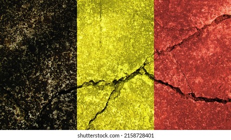 Belgiens flag. Belgiens flag på revnet betonvæg