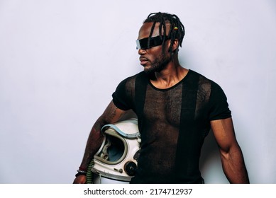 cinematic image of a futuristic astronaut. Man wearing modern eyewear and an astronaut helmet