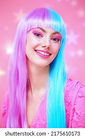 Cute girl with bright makeup and in colored violet-blue wig posing in stylish pink dress. Pink background with shining stars. Fashion. Hairstyle, hair coloring, make-up. Japanese anime style. 