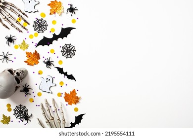 Happy Halloween holiday concept. Halloween decorations on white background. Flat lay, top view, copy space.