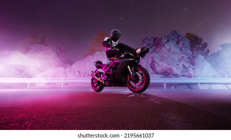 Moto rider making a stunt on his motorbike. Motorcycle stunt riding.