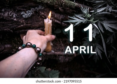 kalenderdatum op de achtergrond van een esoterisch spiritueel ritueel. 11 april is de elfde dag van de maand.