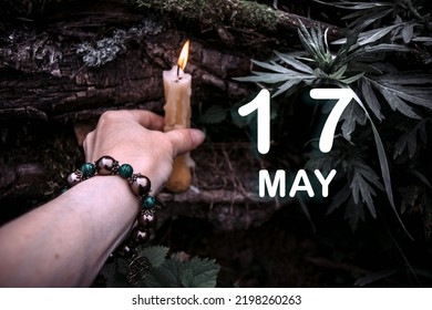 calendar date on the background of an esoteric spiritual ritual. May 17 is the seventeenth day of the month.