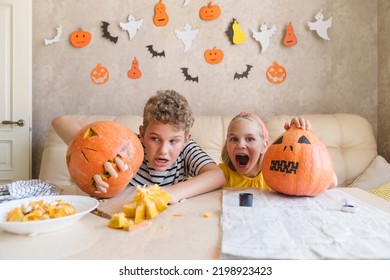 Funny kids with pumpkins for Halloween.