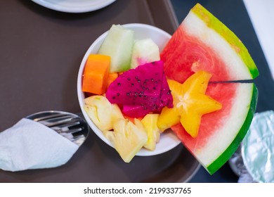 The fruit ball is served in a small bowl as a dish after breakfast.