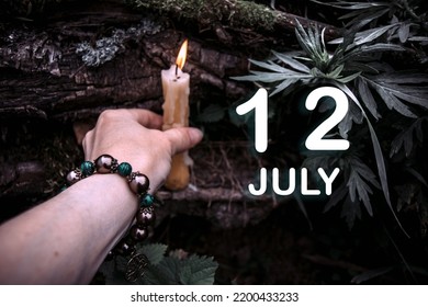 calendar date on the background of an esoteric spiritual ritual. July 12 is the twelfth day of the month.