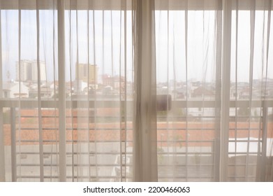 The window cover. Semarang, Indonesia, September 11, 2022, korden atau gorden kamar hotel dengan latar kota semarang dilihat dari jendela kamar hotel di pagi hari terlihat menarik