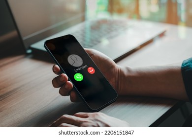 Man answering to incoming call. Phone call from unknown number. Call center gang, scammer or stranger. Hoax person with fake identity. Scam, fraud or phishing with mobile phone or smartphone concept.