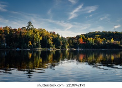 Cottage docks line the shore of this small peaceful lake.