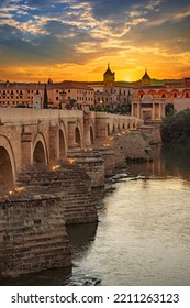Cordoba, Spain. Roman Bridge on Guadalquivir river and The Great Mosque (Mezquita Cathedral) in the city of Cordoba, Andalusia.