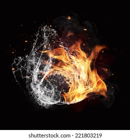 黒の背景に分離された水と火のエネルギーのシンボル