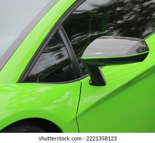 Luxury sports car in bright exotic color. Details of super car. 