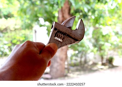 a wrench held by someone