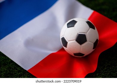 France national football team. National Flag on green grass and soccer ball. Football wallpaper for Championship and Tournament in 2022. World international match.