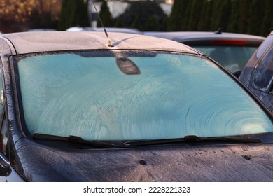 11.19.2022 wroclaw, poland, Frosted car windows on a winter morning in the parking lot.