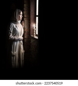 Lone retro rural veil cloth jew slave maid life sad poor lady face look cry plead bible Jesus. Holy cold kid child think ask beg old biblical god Christ wait even flame light war home room text space