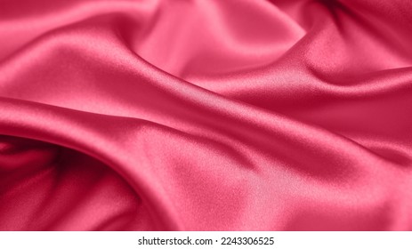Viva Magenta, tessuto rosso magenta nei toni del rosso. Primo piano della trama del raso di seta rosa per cucire. Carta da parati con sfondo astratto. Tessuto a pieghe attorcigliate. Colore di tendenza dell'anno 2023. Modello di colore alla moda