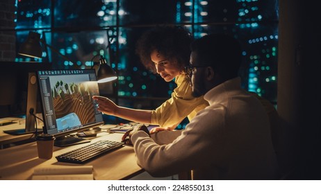 Two Stylish Employees Discussing Landscape Project on Computer in Architectural Agency in Loft Office. Young Creative Director and Designer Talking About Work, Making Changes on Corporate Project.