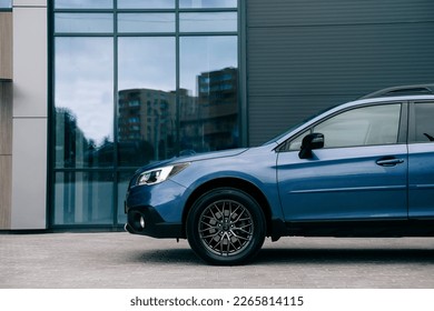 Modern subcompact crossover SUV,  beautiful wheels, large chrome grille.