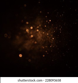 glitter vintage lights background. dark gold and black. defocused