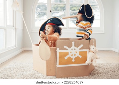 Playing, box boat and pirate children role play, fantasy imagine or pretend in cardboard container. Telescope, fun home game or sailing black kids on Halloween cruise adventure with yacht captain