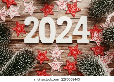 Glécklecht Neit Joer 2024 a Chrëschtdekoratioun op hëlzenem Hannergrond