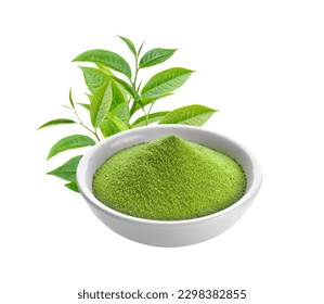 bubuk teh hijau dalam mangkuk dan daun pada latar belakang putih