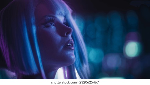 Cinematic Close Up Portrait of a Young Cosplay Model Wearing Futuristic Clothes, Striking Makeup and a Short Blue Wig, Female Enjoying a Beautiful Night Life Scenery in a Neon High Tech City