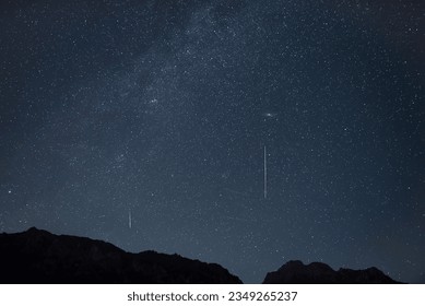 Perseid meteor shower 2023 in the night sky.