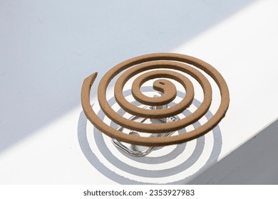 A mosquito coil is a mosquito-repelling incense.