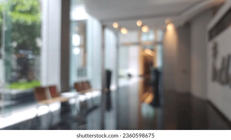 Bulanık otel veya ofis binası lobisi, resepsiyon salonuna doğru bulanık arka plan iç görünümü, bulanık koridor ve bina cam duvar penceresine sahip modern lüks beyaz oda alanı