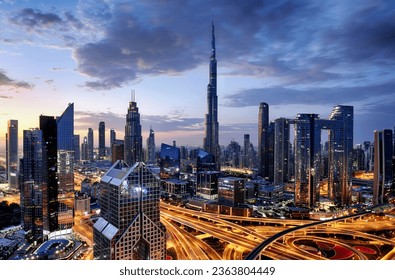 Dubai modern skyline  architecture by night with illuminated skyscrapers, United Arab Emirates