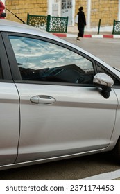 A part of a car in the street