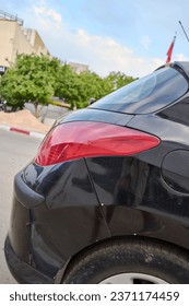 A part of a car in the street