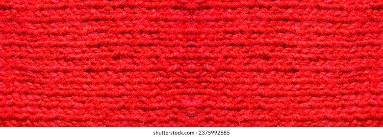 Tissu à motifs en laine. Tissu tricoté fait main avec texture de fond en laine rouge