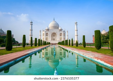 The Taj Mahal at sunrise in Agra, India. Translation of Arabic inscriptions: "O SOUL, THOU ART AT REST. RETURN TO THE LORD AT PEACE WITH HIM, AND HE AT PEACE WITH YOU."