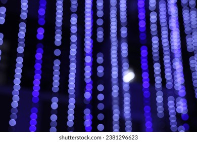 vertical lines of light bokeh in the night