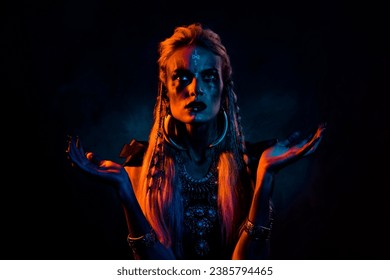 Photo of wild mysterious lady wear viking clothes praying death gods isolated dark orange color background