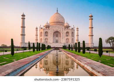 Taj Mahal is a white marble mausoleum on the bank of the Yamuna river in Agra city, Uttar Pradesh state, India