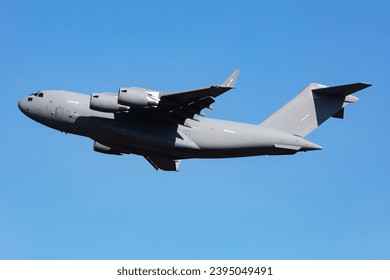 Untitled military transport plane at air base. Airport and airfield. Air force and army flight operation. Aviation and aircraft. Air lift. Military industry. Fly and flying. Commercial theme.