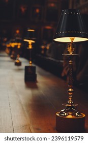 At Oxford University, an enchanting dining table setup with a row of lights on the table, evoking a magical Harry Potter-like atmosphere
