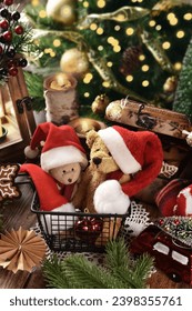 Cute teddy bear mascots in Santa Claus hats and Christmas decorations in rustic style arrangement