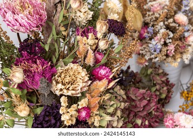 Dried flowers arrangement close up. Sustainable floristry. Home decor with dried flowers.