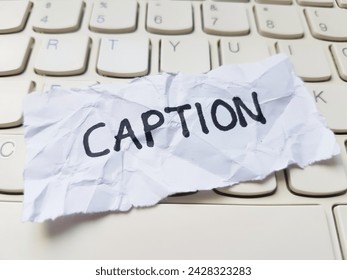 Caption writting on laptop keyboard background.