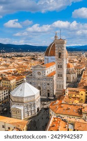 Vertical aerial cityscape view on the dome of Santa Maria del Fiore church and old town in Florence