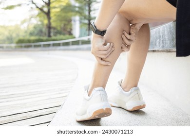 Exercise Associated Muscle Cramps,woman suffering from calf pain,muscular spasms and cramps or Achilles tendinitis,damage to muscles and tendons in calf of the leg,pain in Gastrocnemius and Soleus
