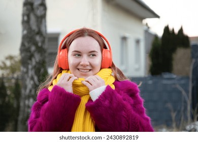 young happy carefree girl holds rose in her hands